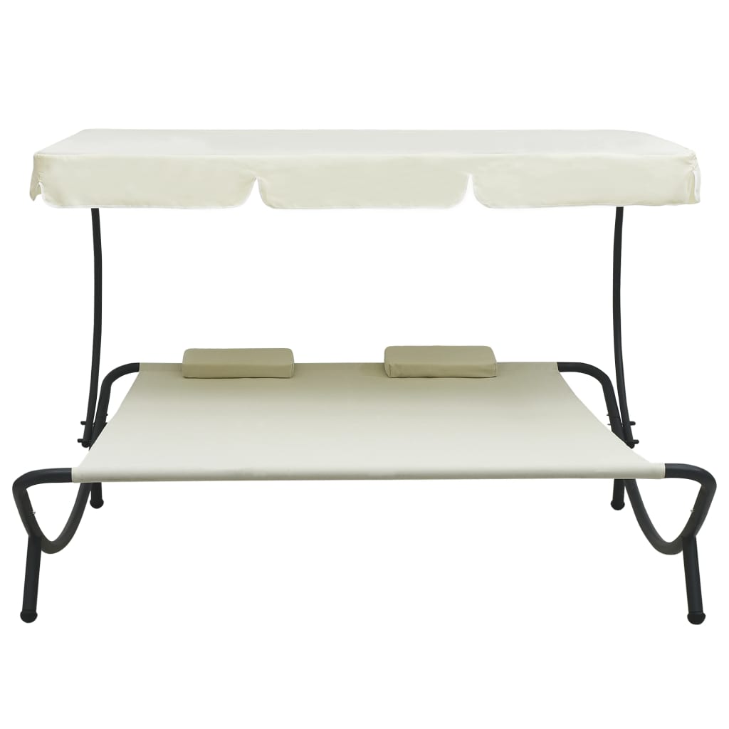 Outdoor rest bed with cream white awning and pillows