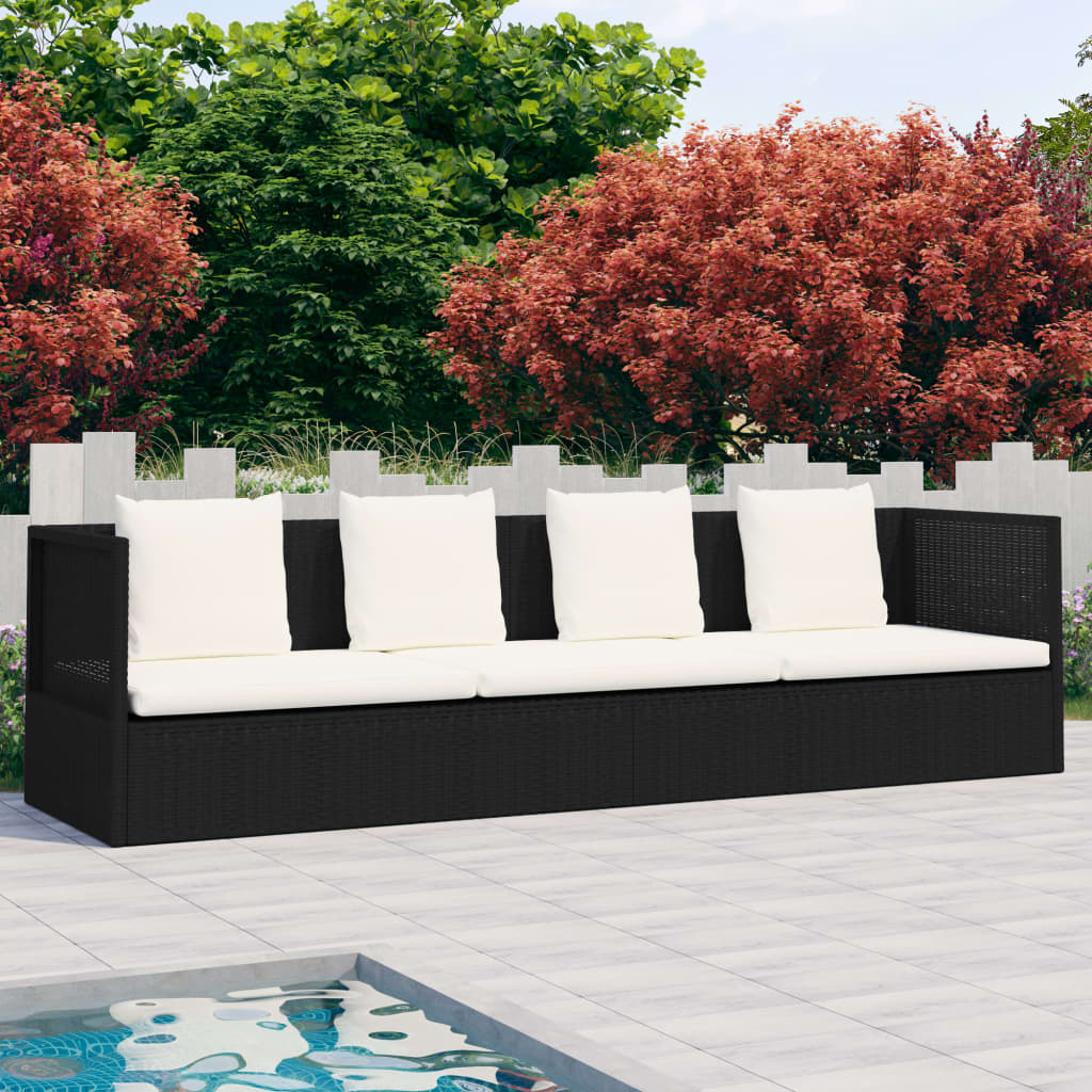 Garden bed with cushion and black braided resin pillows