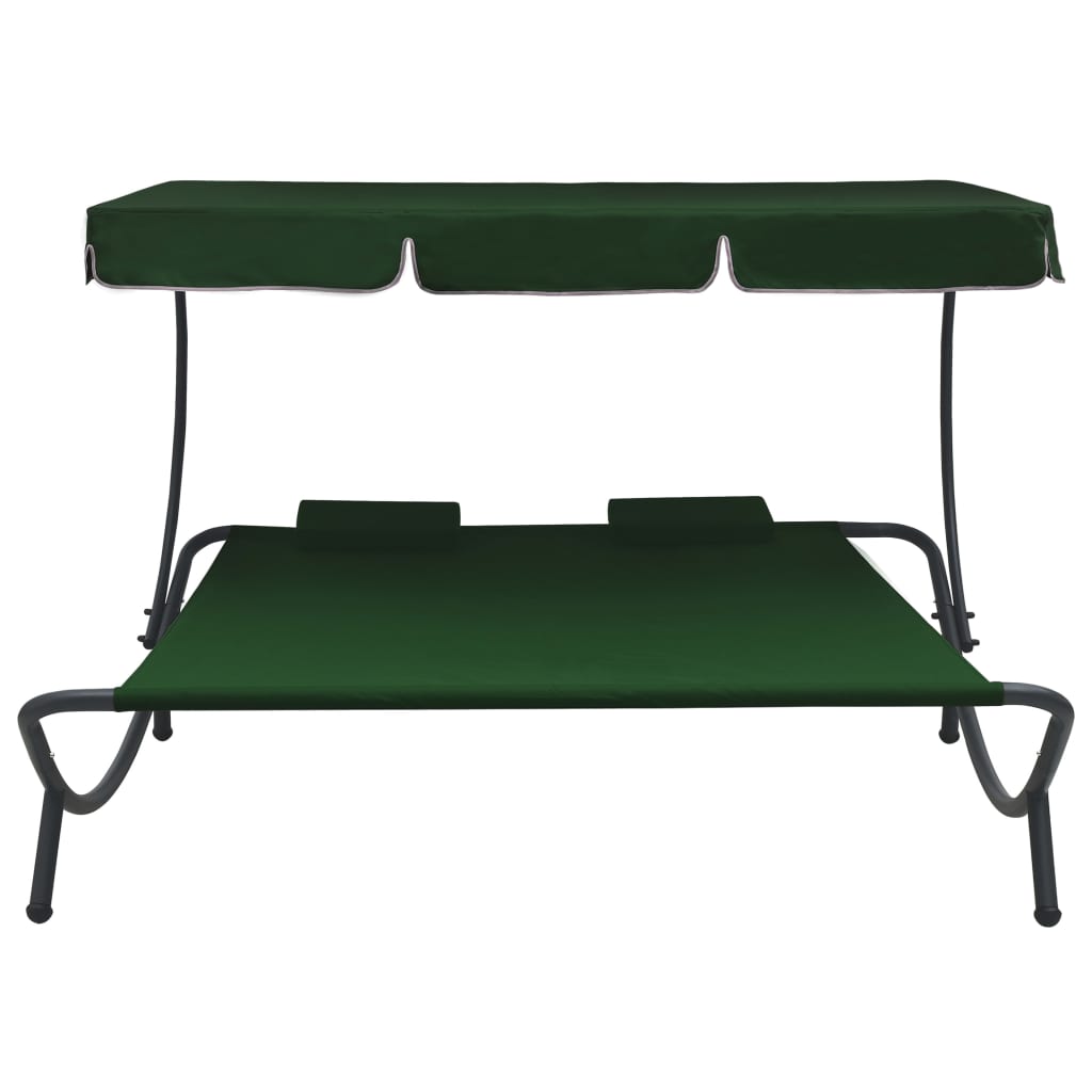 Outdoor rest bed with awning and green pillows