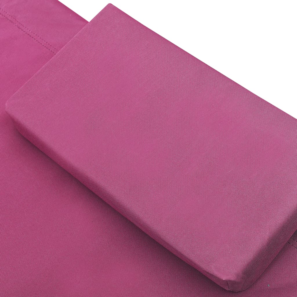 Outdoor rest bed with pink awning and pillows